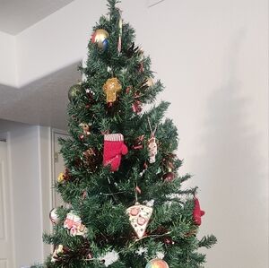 Festive Green Christmas Tree with Red and Gold Ornaments